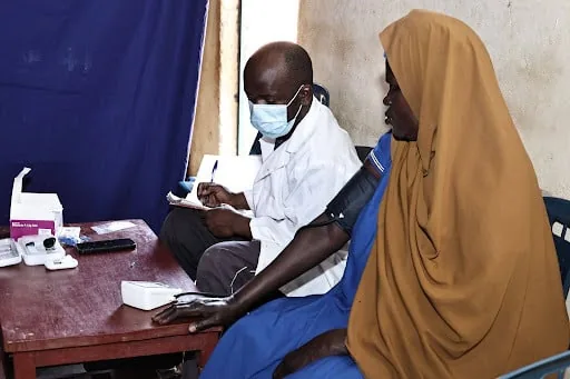 Patient receiving attention from a health professional