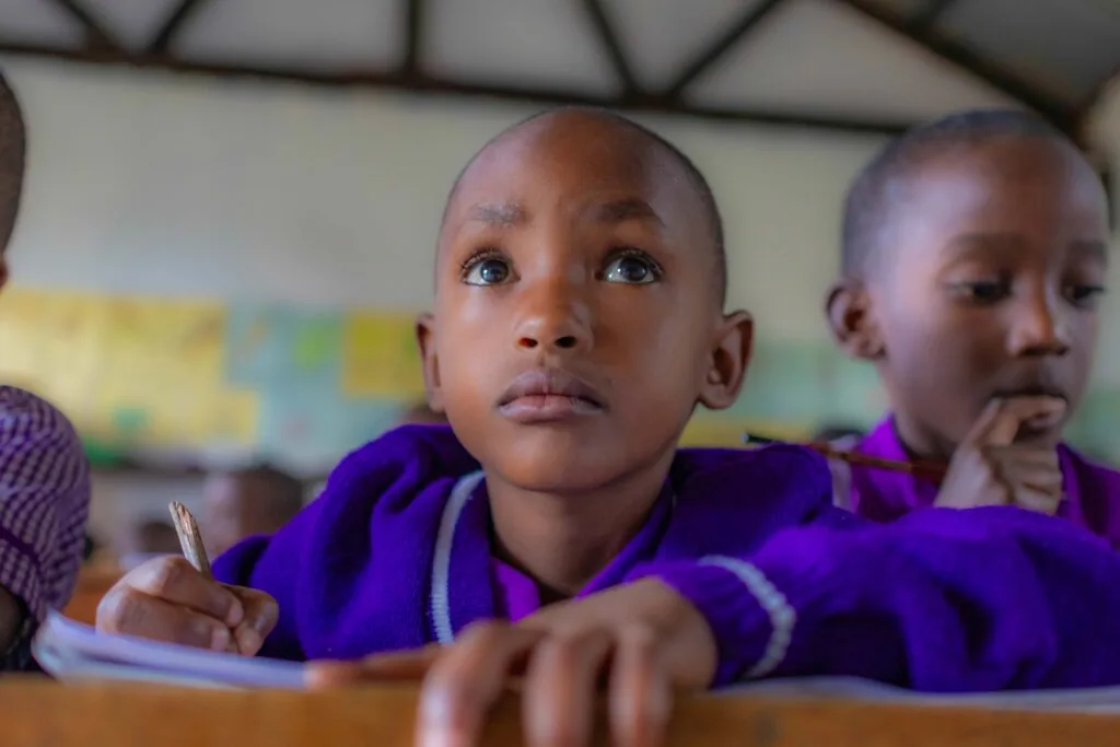 Students writing in a classroom