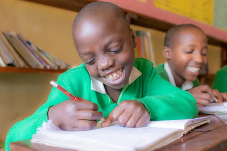 Schoolchildren working on exercise books in class