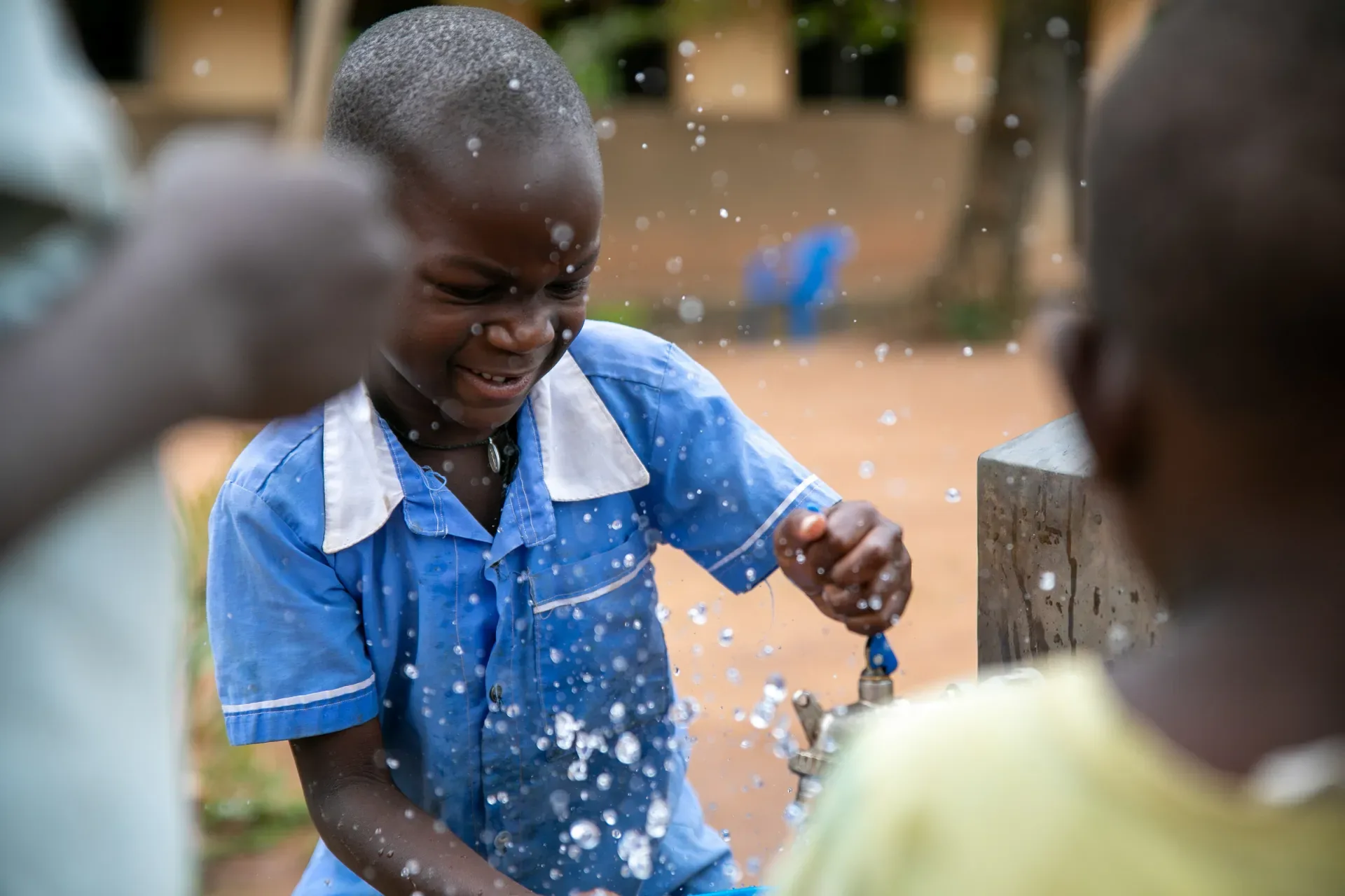 Child using a water tap